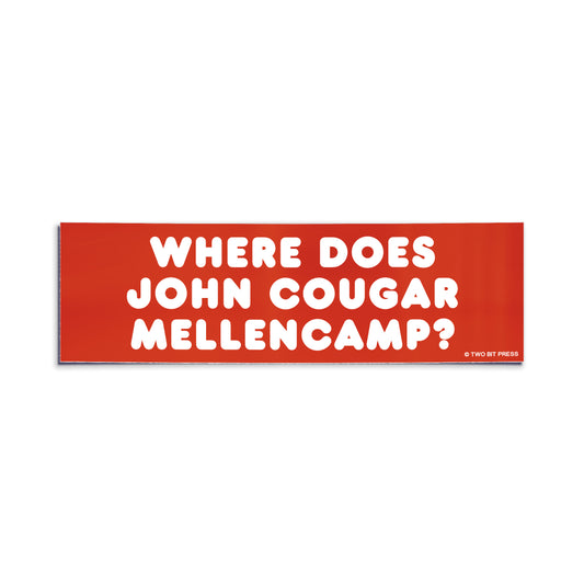 Red bumper sticker with white text reading “Where Does John Cougar Mellencamp?” by Two Bit Press