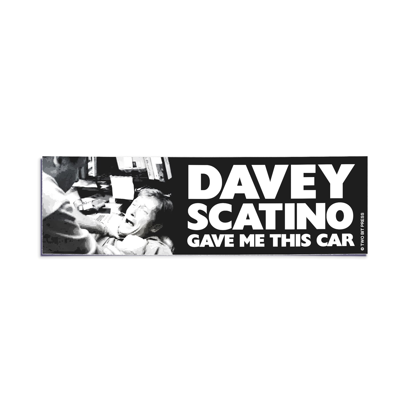 A vinyl bumper sticker showing the Sopranos and the text "DAVEY SCATINO GAVE ME THIS CAR" on a white background.