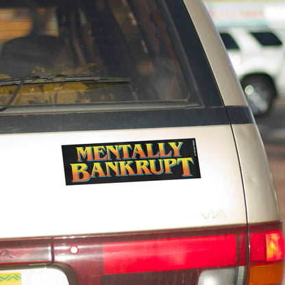 A vinyl bumper magnet reading "MENTALLY BANKRUPT" on gold minivan.