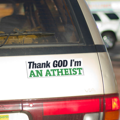A vinyl bumper magnet reading "Thank GOD I'm AN ATHEIST" on gold minivan.