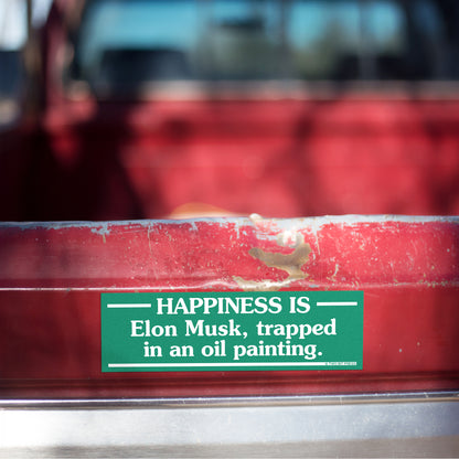 A vinyl bumper magnet reading "HAPPINESS IS Elon Musk, trapped in an oil painting." on red truck tailgate.