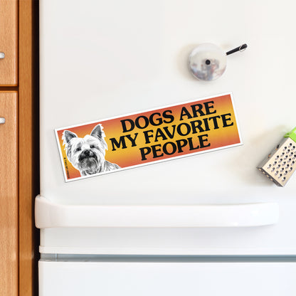A vinyl bumper magnet showing a dog and the text "DOGS ARE MY FAVORITE PEOPLE" on a white fridge.