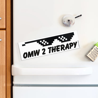 A vinyl bumper magnet showing sunglasses and the text "OMW 2 THERAPY" on a white fridge.