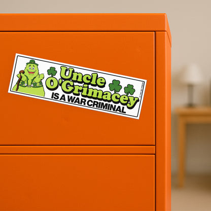 A vinyl bumper magnet showing O'Grimacey and the text "Uncle O'Grimacey IS A WAR CRIMINAL" on orange filing cabinet.