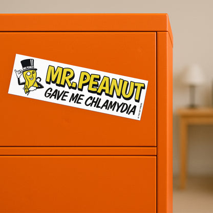 A vinyl bumper magnet shwoing Mr. Peanut and the text "MR. PEANUT GAVE ME CHLAMYDIA" on orange filing cabinet.