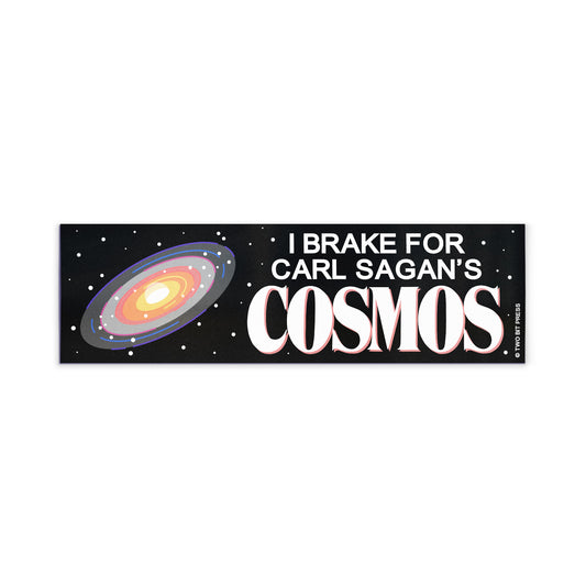 A vinyl bumper magnet showing a galaxy graphic and the text "I BRAKE FOR CARL SAGAN'S COSMOS" on a white background.