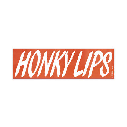 A vinyl bumper magnet reading "HONKY LIPS" on a white background.