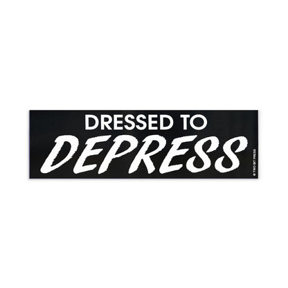 A vinyl bumper magnet reading "DRESSED TO DEPRESS" on a white background.