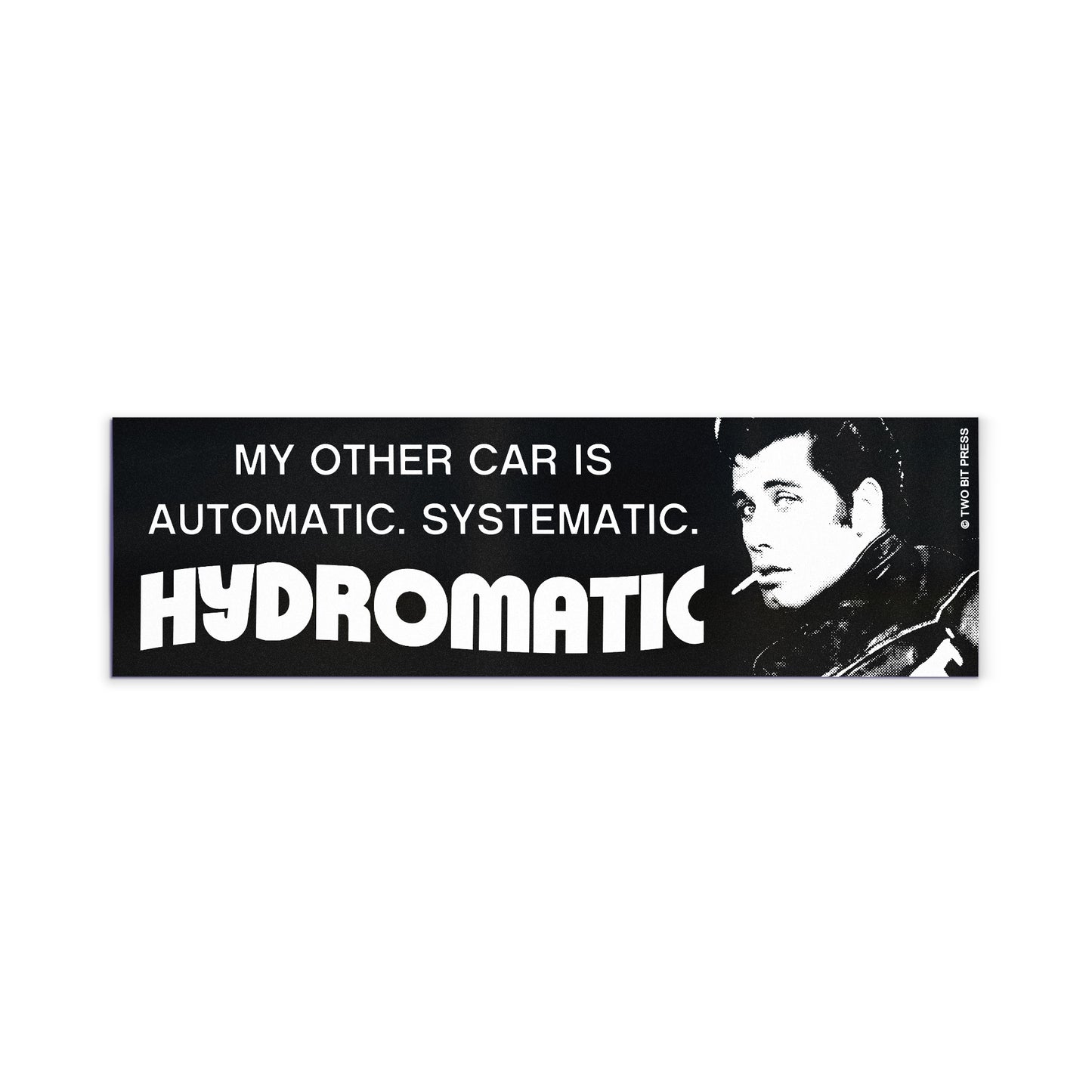 A bumper magnet showing John Travolta and the text "MY OTHER CAR IS AUTOMATIC SYSTEMATIC HYDROMATIC" on a white background.