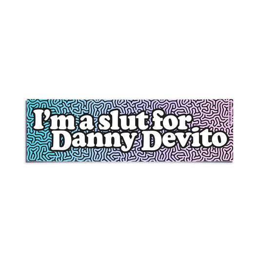 A vinyl bumper sticker reading "I'm a slut for Danny Devito" on a white background.