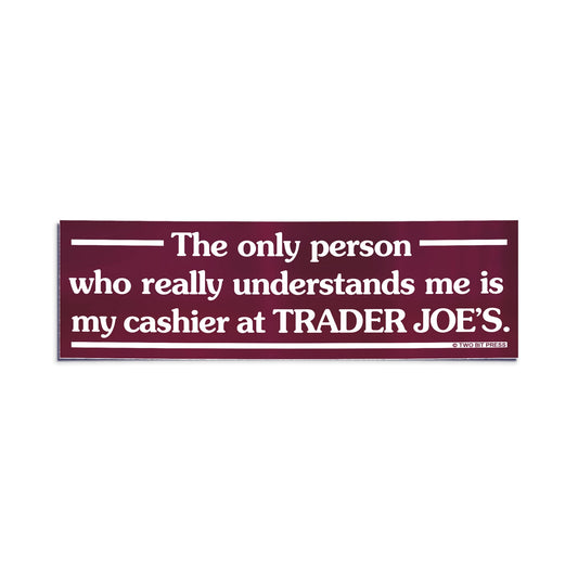 A vinyl bumper sticker reading "The only person who understands me is my cashier at TRADER JOE'S." on a white background.