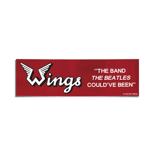 A vinyl bumper sticker reading "WINGS THE BAND THE BEATLES COULD'VE BEEN" on a white background.